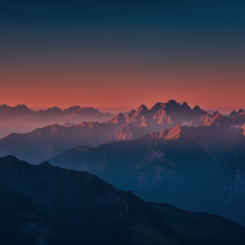 Create a premium artistic landscape of layered mountain ranges at sunrise. Deep cobalt and midnight blue shadows contrast with vivid coral red, crimson and warm vermilion light illuminating the mountain peaks. A soft atmospheric gradient transitions from dark blue at the top to glowing reddish dawn near the horizon. Minimalist composition, sculptural mountain silhouettes, subtle natural textures, refined color blocking, cinematic depth and an editorial art direction. Visually striking yet restrained, with a limited cohesive color palette. No text, no logos, no buildings, no people, no excessive details. Square 1:1 composition, high resolution.